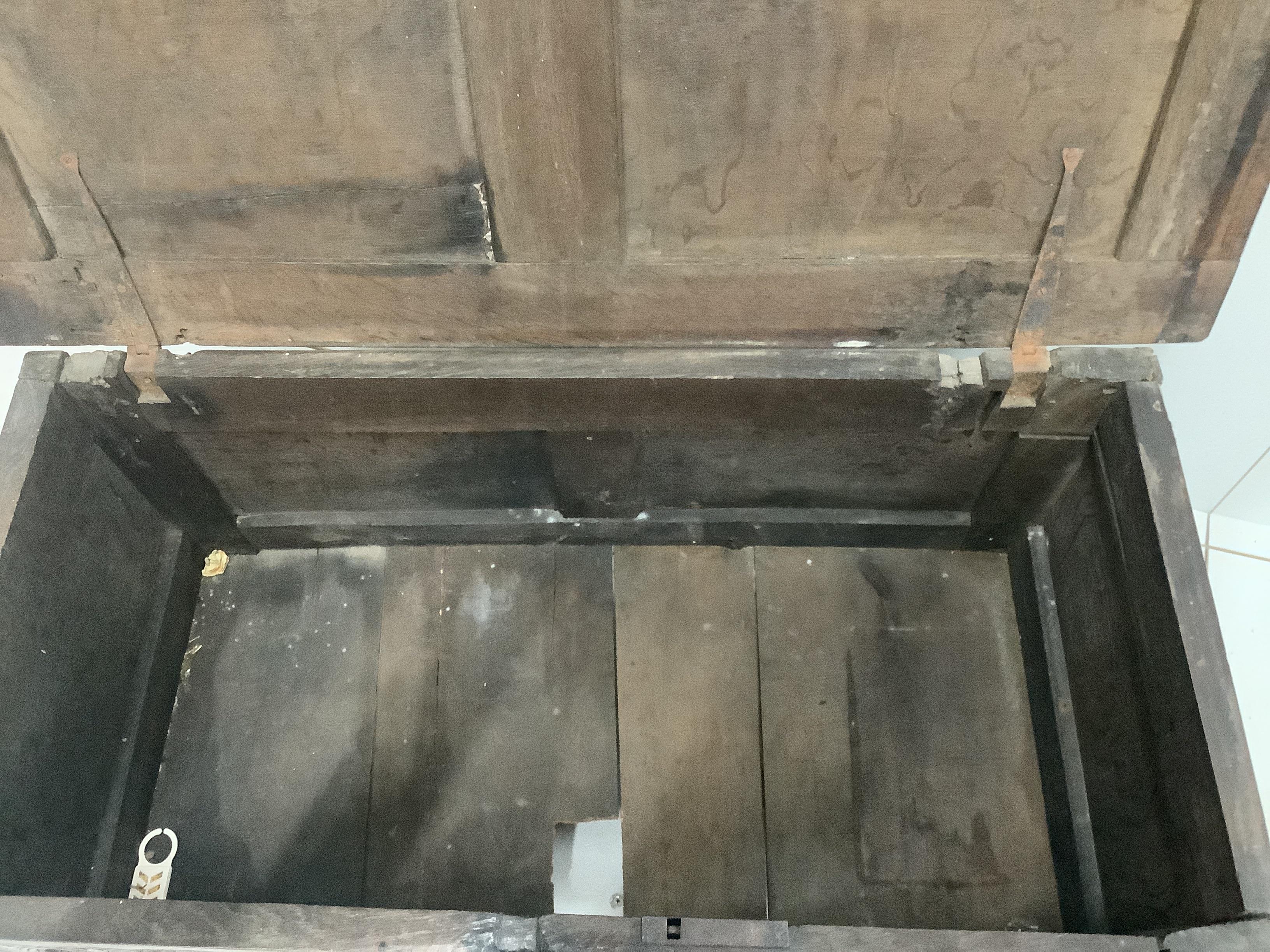 A 17th century panelled oak coffer, width 104cm (hole in top panel)